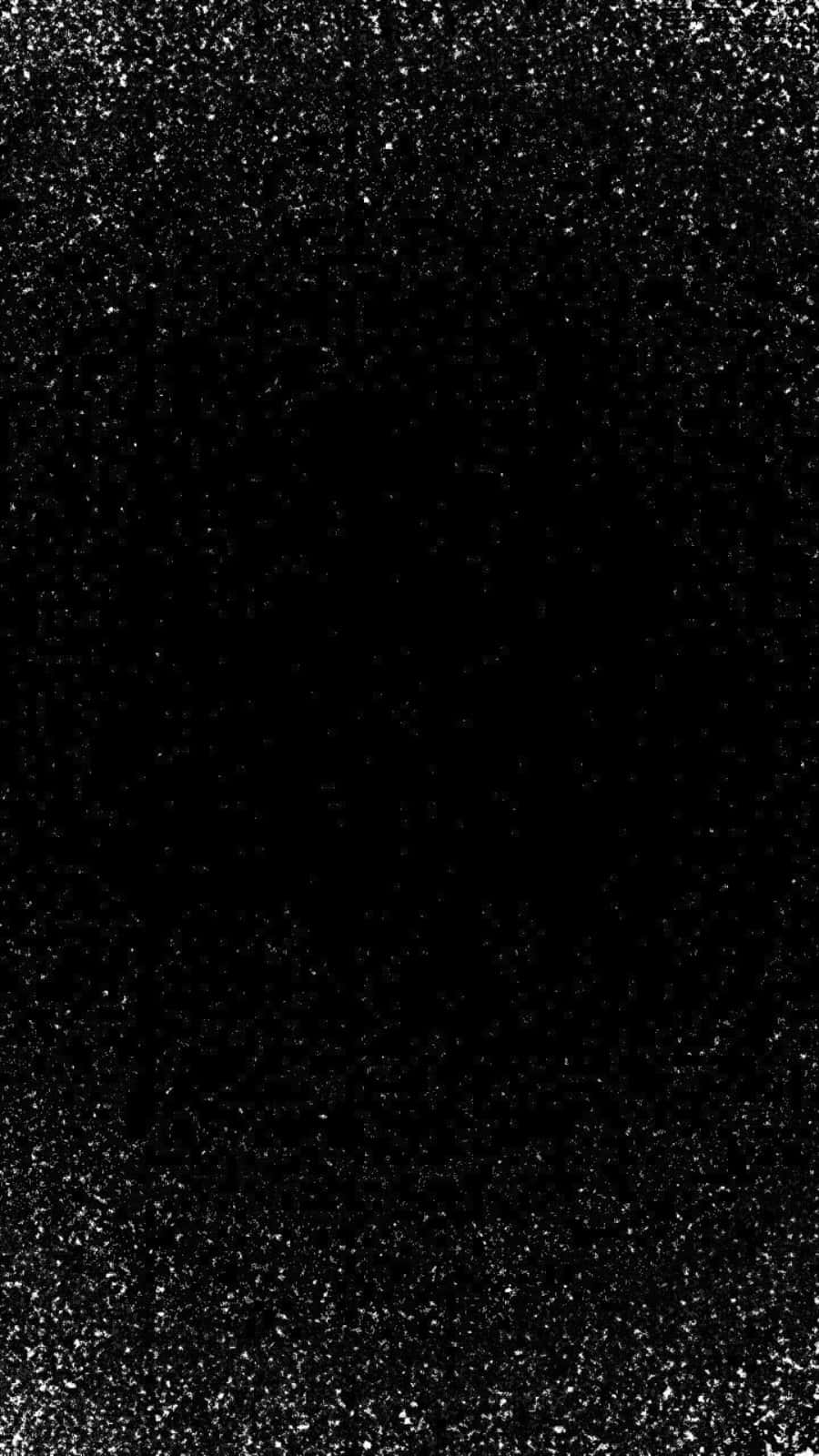Black Glitter 桌布 壁紙 — 黑色背景上點綴著細小的白色亮粉顆粒，營造出閃爍的紋理效果。