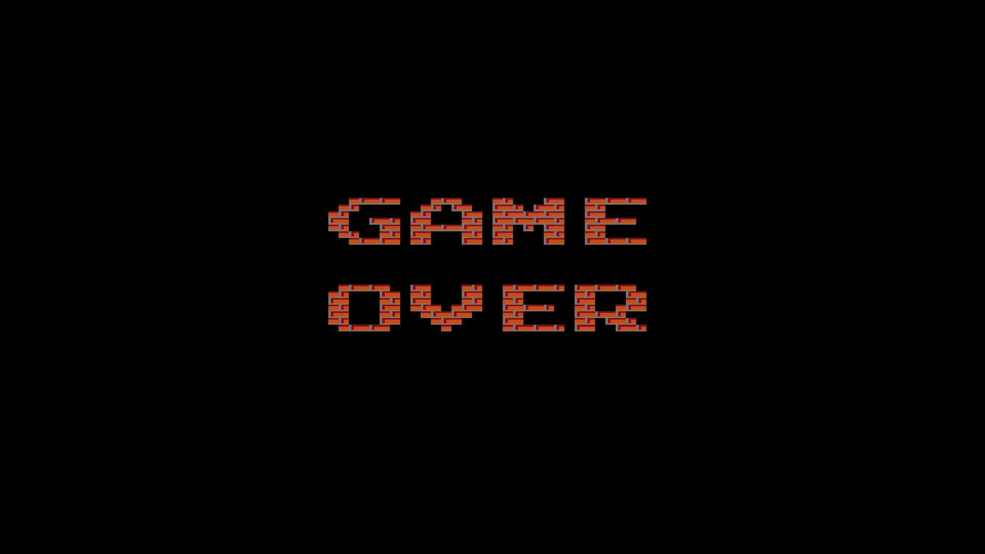 Dark Game Over 桌布 壁紙 — 黑色背景中央以紅色磚塊呈現大膽像素化遊戲結束文字。
