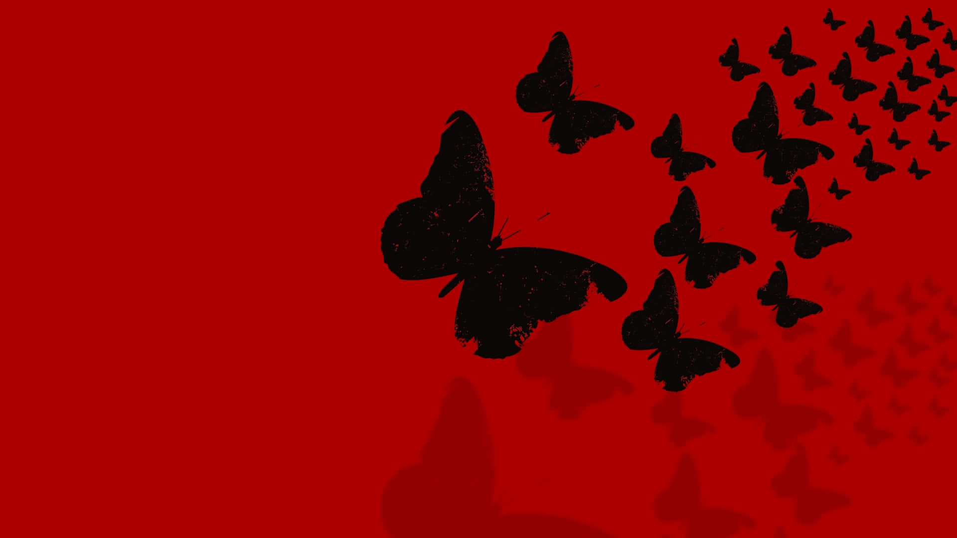 Dark Butterfly 桌布 壁紙 — 黑色蝴蝶剪影以對角線飛過鮮紅色背景，帶有微妙的陰影效果。