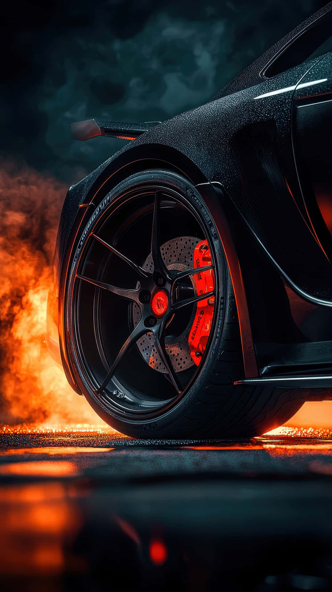 High-Performance Supercar Wheel with Fiery Background and Carbon Fiber Detail 壁紙 — 黑色跑車的車輪與發光的紅色制動卡鉗在熾熱的橙色火焰和黑煙中脫穎而出。