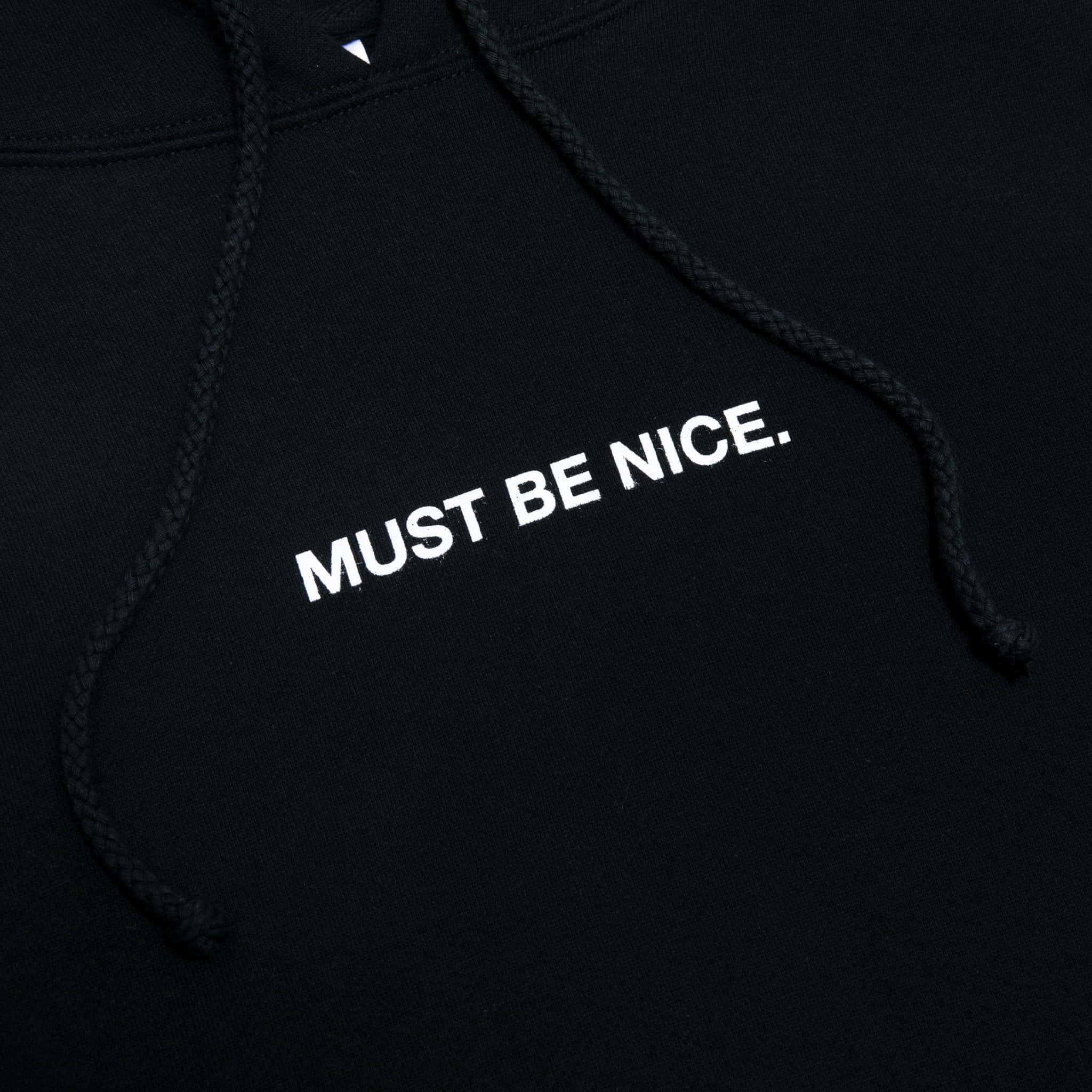 ripndip 桌布 壁紙 — 黑色連帽上衣近距離特寫，白色刺繡文字寫著 MUST BE NICE。