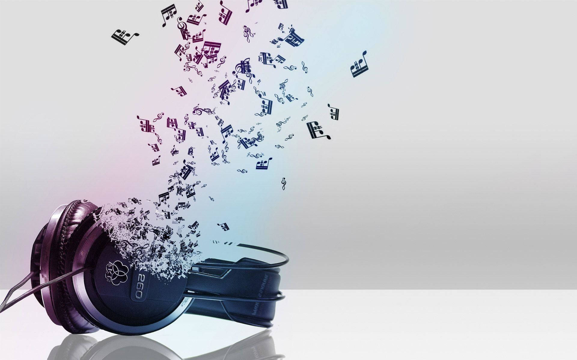 Beautiful Music 桌布 壁紙 — 黑色頭戴式耳機在柔和漸變背景上散發出漂浮的音樂音符。