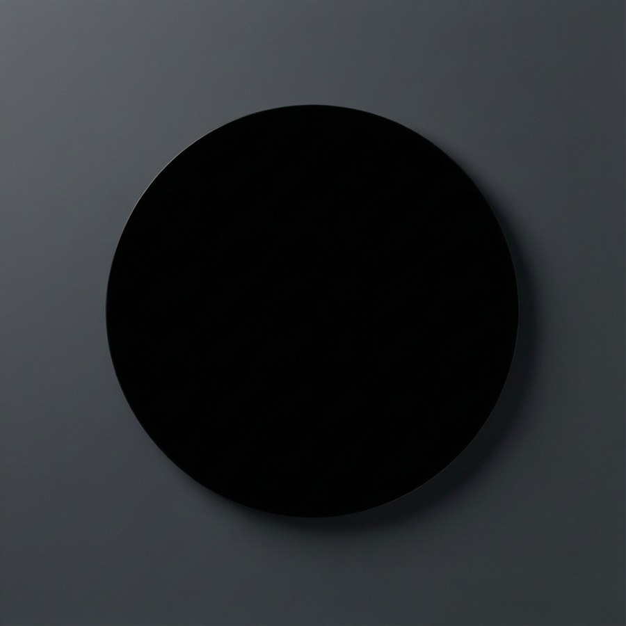 Simple black circle on dark grey background, modern minimalist wallpaper.