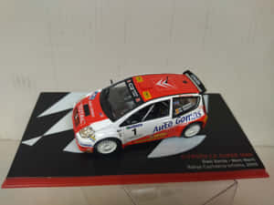2005年雪鐵龍C2拉力賽車的比例模型，附有車手姓名和活動詳情。 — 超跑 壁紙