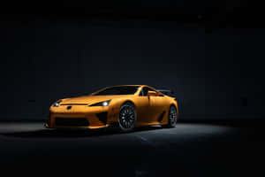 橙色Lexus LFA跑車在黑暗車庫中被照亮。 — Surface Pro 壁紙