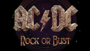 ACDC樂團標誌，帶有金屬金色的rock or bust文字，置於深色背景上。 — Acura 壁紙