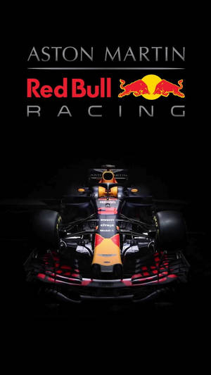 Aston Martin Red Bull Racing 一級方程式賽車在黑色背景上帶有發光點綴。 — F1 iPhone 壁紙