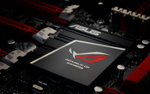 ASUS ROG 遊戲主機板，帶有紅色和黑色組件。 — 遊戲玩家標誌 壁紙