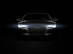 Audi 汽車正面，在黑暗的攝影棚中車頭燈閃耀 — 奧迪 GIF 壁紙