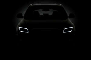 Audi 汽車正面視圖，頭燈在黑暗中發光。 — 奧迪 GIF 壁紙