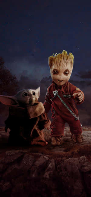Baby Yoda 和 Groot 站在岩石上，背景是佈滿星星的夜空。 — Marshmello iPhone 壁紙
