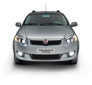 在攝影棚環境中，銀色 Fiat Palio Weekend Trekking 汽車，車頭燈亮起。 — 飛雅特 壁紙