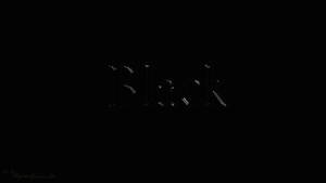 「Black」這個字在深色數位字體中柔和發光。 — 簡約暗黑美學 壁紙