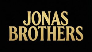 黑色背景上寫有Jonas Brothers的金色文字。