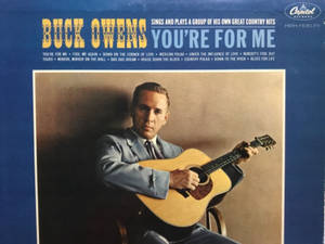 Buck Owens 在復古專輯封面上手持原聲吉他。 — 專輯封面 壁紙