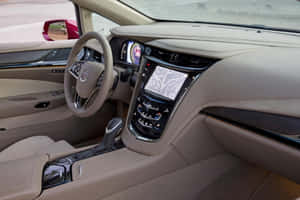 米色皮革 Cadillac 汽車內飾，配備數位儀表板和觸控螢幕。 — 凱迪拉克 壁紙