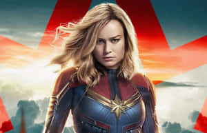 Captain Marvel 身穿戰衣，頭髮隨風飄揚，背景是星爆天空。 — 漫威復仇者聯盟 壁紙