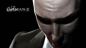 《Hitman 2 Silent Assassin》角色的頭部特寫，帶有陰影的臉龐和西裝。 — 電玩遊戲 GIF 壁紙