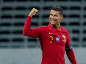 Cristiano Ronaldo 身穿紅色葡萄牙國家隊球衣慶祝勝利。 — 克里斯蒂亞諾·羅納度 壁紙