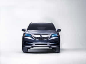 時尚深灰色Acura SUV，在工作室環境中配備藍色LED頭燈。 — Acura 壁紙