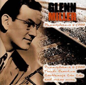 Glenn Miller 穿著燕尾服在火車軌道旁微笑，上面有歌曲標題。 — 馮·米勒 壁紙