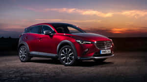 紅色Mazda CX-3 SUV在日落時停泊在碎石上 — 馬自達 壁紙
