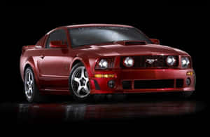 紅色Roush Mustang跑車，配備定制輪圈和車頭燈，在深色反光地板上。 — 野馬GIF 壁紙