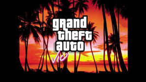 日落時棕櫚樹上的 Grand Theft Auto Vice City 標誌 — 剪影 壁紙