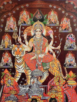 女神杜爾迦坐在老虎上，多臂手持武器，周圍環繞著神聖人物。 — Maa Durga 壁紙