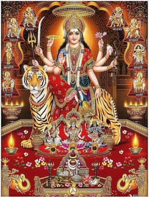 印度教女神杜爾迦在老虎上，帶有神聖符號和點燃的油燈。 — Maa Durga 壁紙