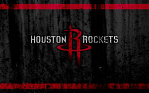 Houston Rockets 籃球隊標誌在深色紋理背景上，帶有紅色點綴。 — 簡約暗黑美學 壁紙