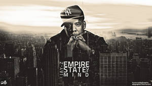 Jay-Z 戴著 Yankees 帽子，手持香菸，置於紐約天際線之上，並帶有 'Empire State of Mind' 文字。 — 帝國大廈 壁紙