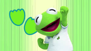 Kermit the Frog 穿著白色Polo衫，在有鬱金香的綠色條紋背景上，笑著舉起拳頭。 — 科米蛙 壁紙
