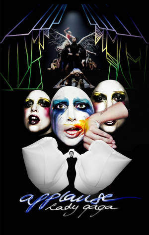 Lady Gaga 以戲劇化妝容與舞者在霓虹燈下的舞台上。 — Redmi Pad 壁紙