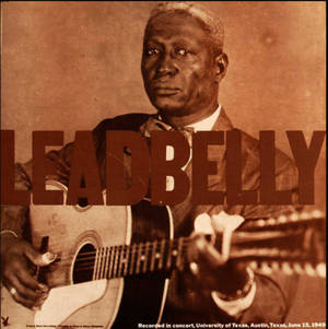Leadbelly 在1949年的復古音樂會照片中彈奏吉他。 — 復古 壁紙