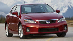 紅色Lexus CT 200h混合動力車停在日落時分的山路上。 — 凌志 壁紙
