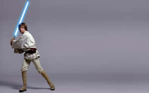Luke Skywalker 手持藍色光劍擺出戰鬥姿勢。 — 酷炫星際大戰 壁紙