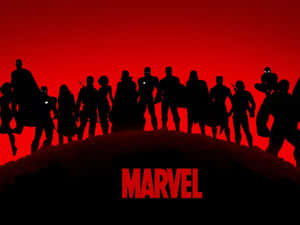 Marvel 超級英雄團隊剪影站在山丘上，背景是紅色天空。 — 漫威復仇者聯盟 壁紙