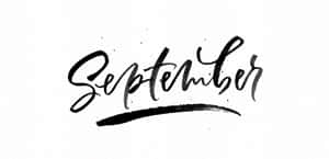 在白色紋理紙張上以粗體黑色毛筆書法書寫的「September」一詞。 — 新年快樂 壁紙