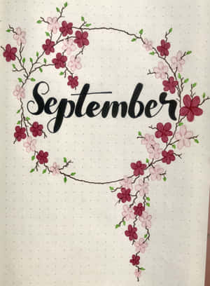在點點紙上被櫻花環繞的草書September。 — iPad Pro 12.9 壁紙