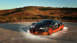 黑色和橙色的Bugatti Veyron停在日落時分的彎曲道路上。 — 布加迪 GIF 壁紙