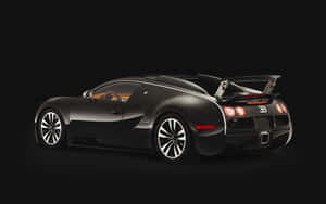 黑色Bugatti Veyron跑車，帶有後翼和發光尾燈，背景為黑色。 — Steam Deck 壁紙