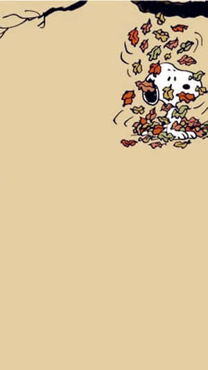 Snoopy 被樹枝下飄落的秋葉覆蓋。 — 可愛秋天 壁紙