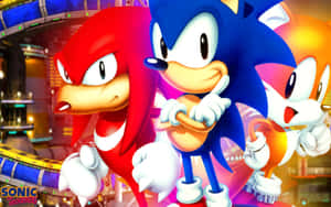 Sonic、Knuckles 和 Tails 在一個霓虹燈照亮、有賽道的未來城市中。 — 音速小子 壁紙