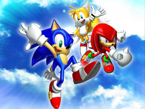 Sonic、Tails 和 Knuckles 在有雲的晴朗天空飛翔。 — 電玩遊戲 GIF 壁紙