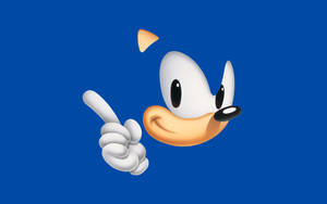 Sonic the Hedgehog 微笑著指向藍色背景 — 音速小子 壁紙
