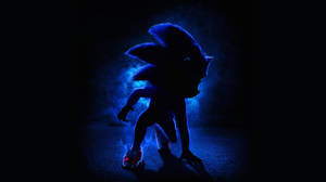 Sonic the Hedgehog 在黑暗煙霧背景中的發光藍色剪影。 — 電玩遊戲 GIF 壁紙