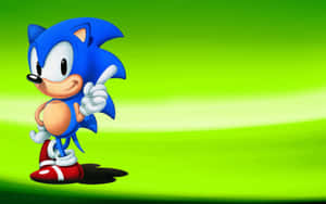 Sonic the Hedgehog 在綠色漸變背景上微笑向前指。 — 索尼克 壁紙
