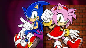 動漫風格的 Sonic 和 Amy Rose 舉起拳頭在磚牆前擺姿勢。 — 音速小子 壁紙