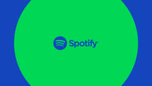 藍色背景上綠色圓圈內的藍色Spotify標誌。 — Spotify 壁紙